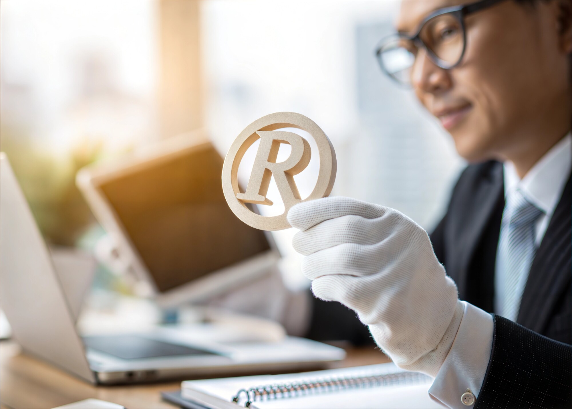 Registered Trademark Symbol Held by Business Professional