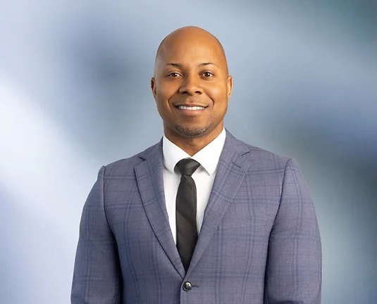 A picture of Ray Littleton smiling at the camera.