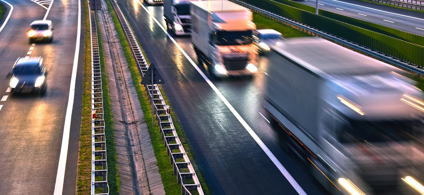 Semi blurred semi-trucks on highway traffic