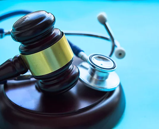 Gavel and stethoscope. medical jurisprudence. legal definition of medical malpractice. attorney. common errors doctors, nurses and hospitals make.