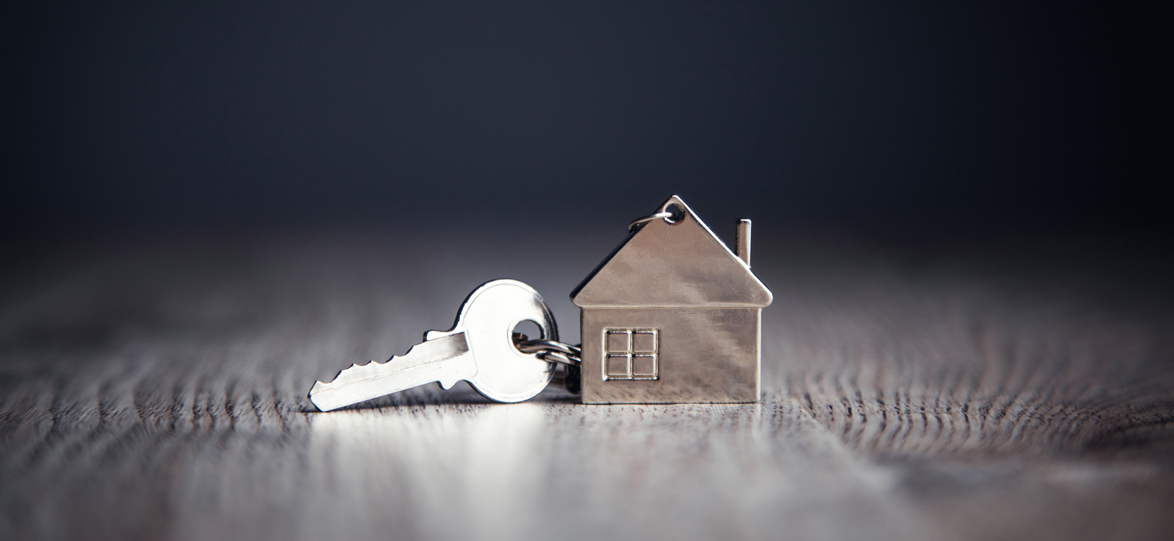 Key on house shaped keychain