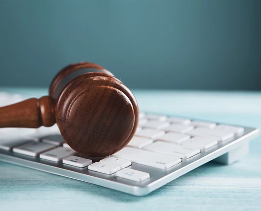 Gavel laying on keyboard