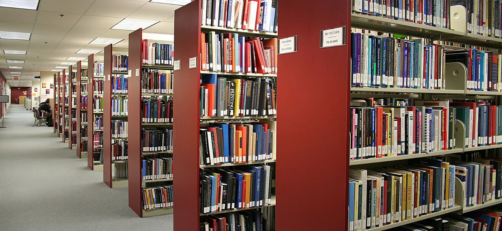 Rows of bookshelves in a library.