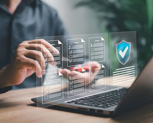 Businessman checking off a list floating in the air.