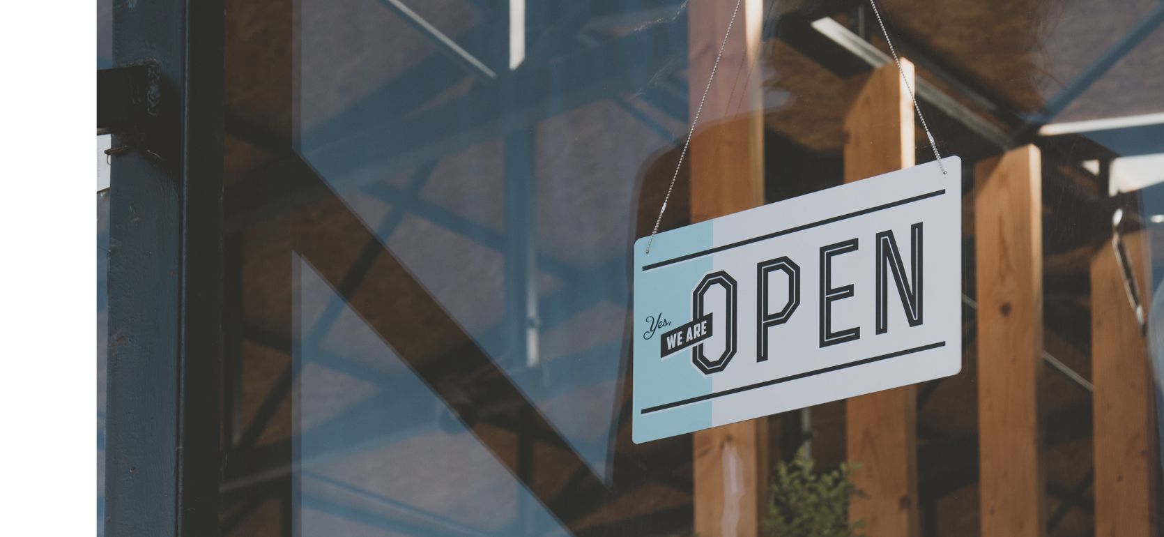Open sign hanging in a window.