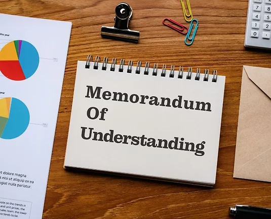 There is notebook with the word MOU.