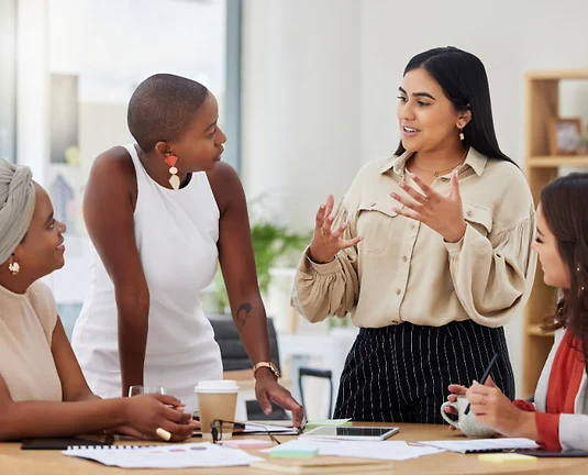 Businesswomen talking in a meeting.