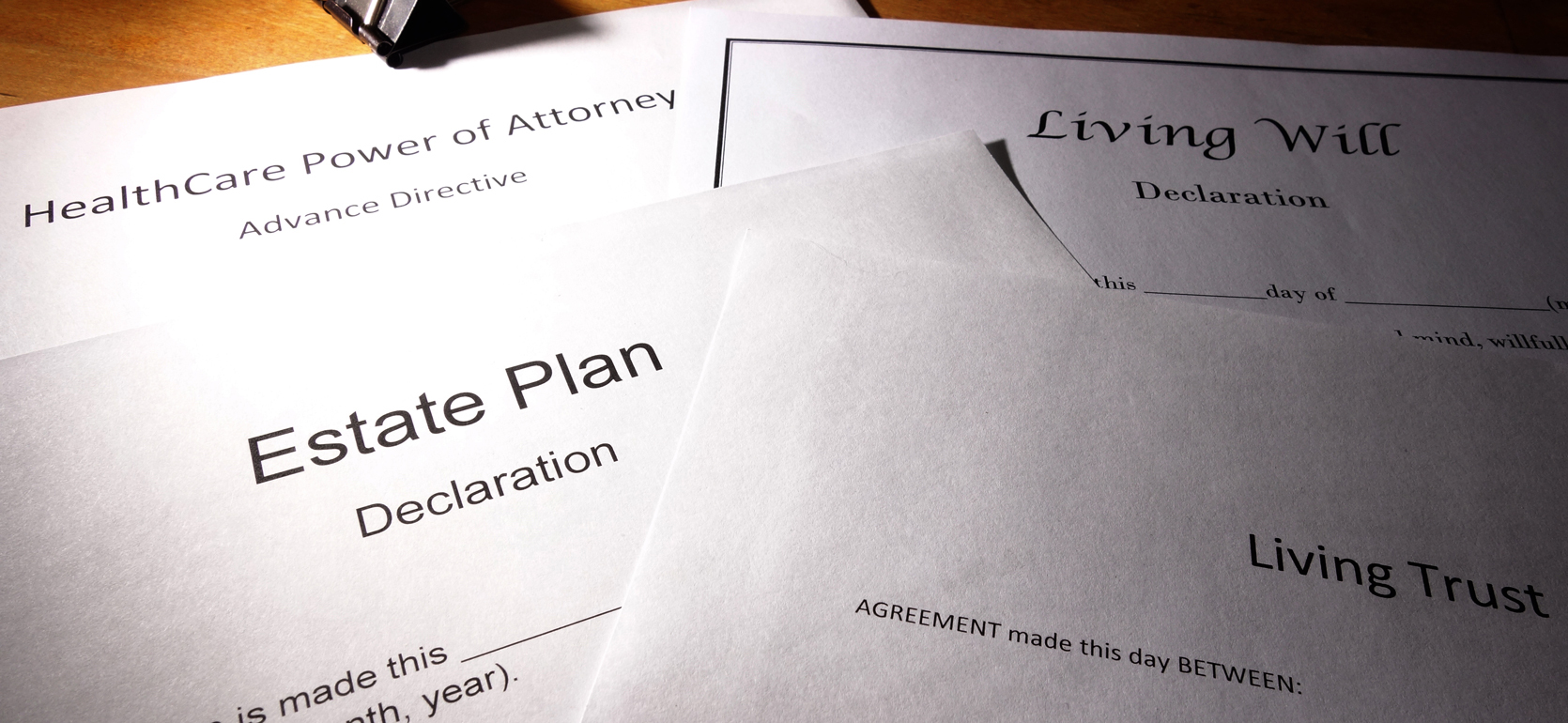 Multiple Different Estate Plans laid on table
