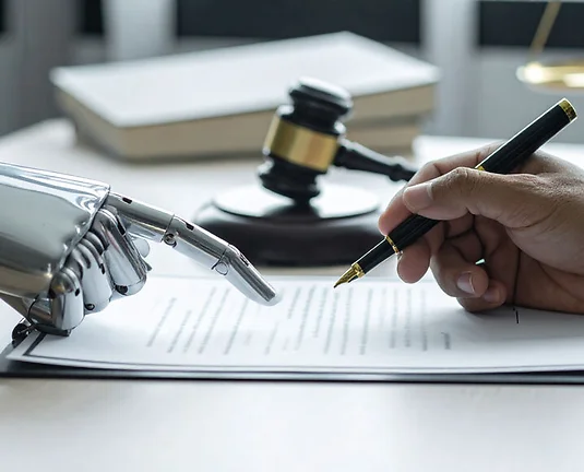 A human hand signing a legal document assisted by robot with gavel in background