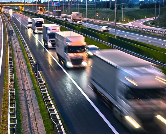 Semi blurred semi-trucks driving on highway