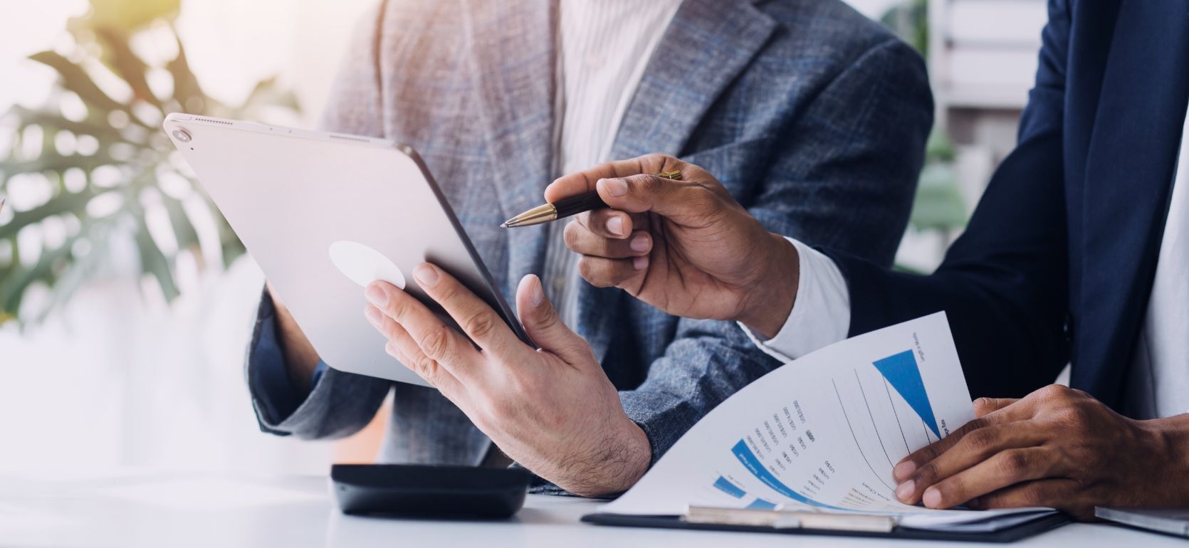 Two people looking over documents.