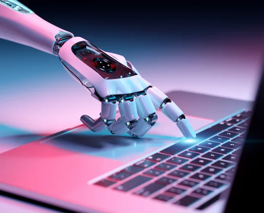 Picture of white robot hand touching a keyboard.
