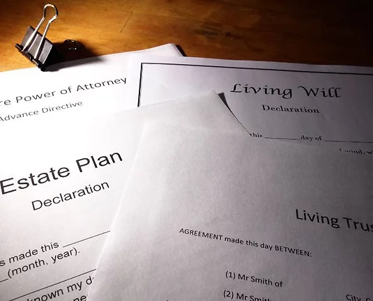 A pile of trust and estate documents.
