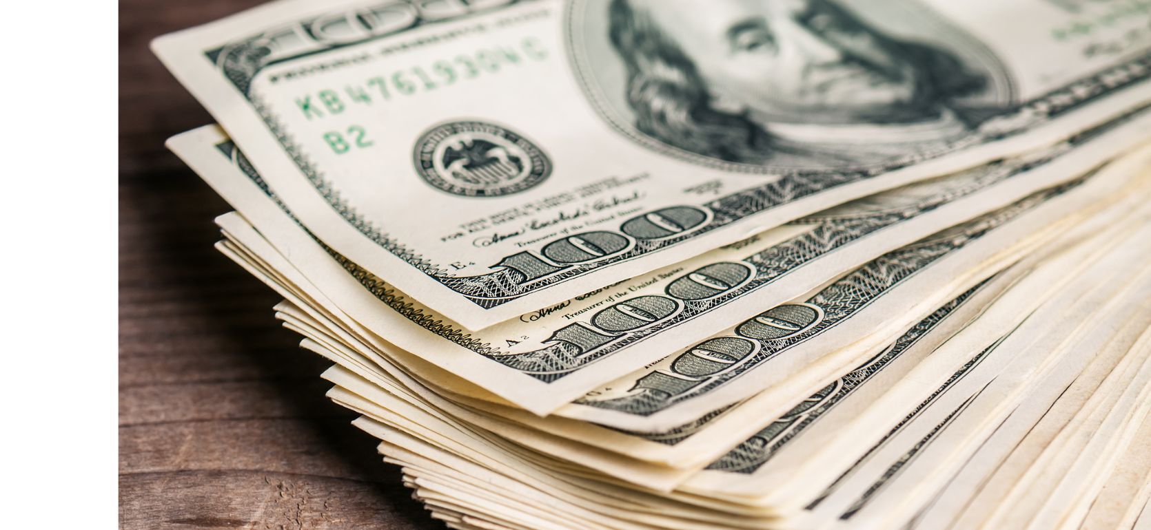 Pile of 100 US dollars.