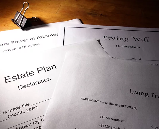 Multiple Different Estate Plans laid on table