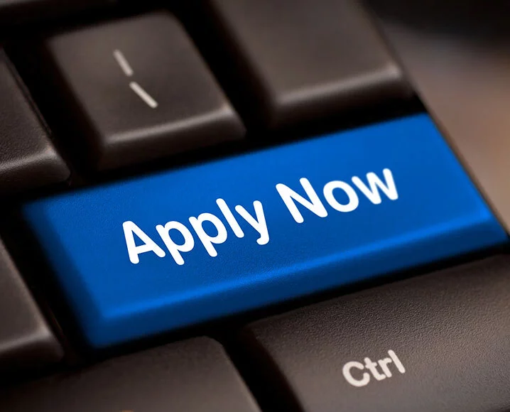 Computer keyboard with blue apply now key