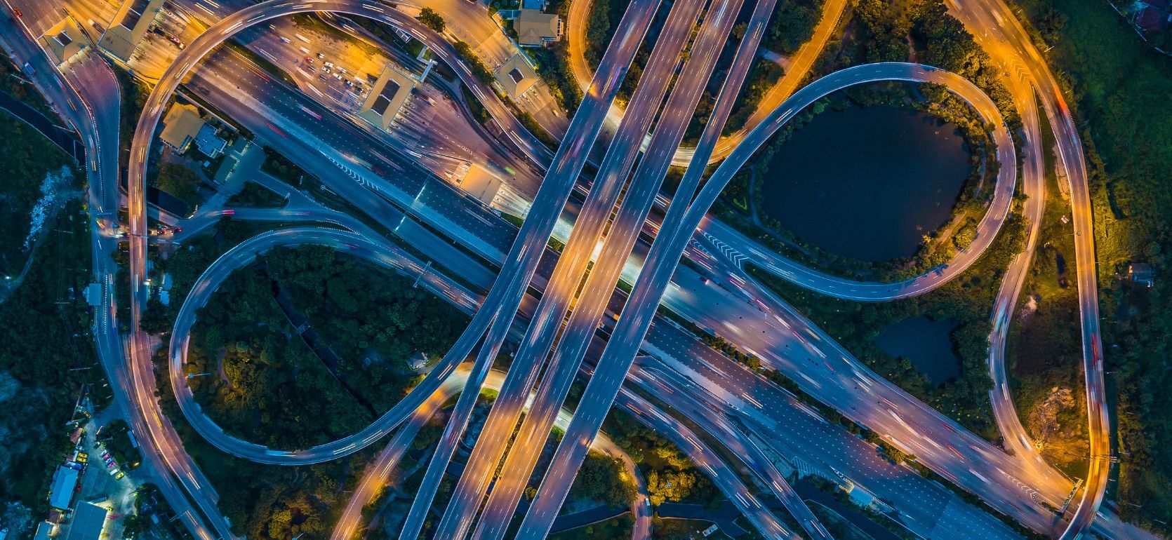 A picture of a highway with cars on the road.